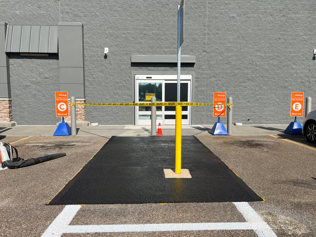 Entrance secured with caution tape and cones, indicating an area under maintenance at a retail store.